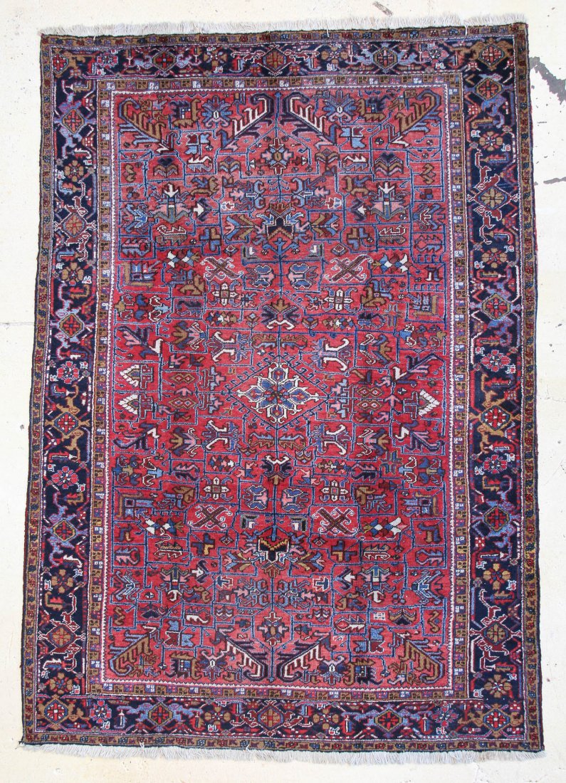 Heriz Rug: 8'10" x 11'3": Heriz Rug, Persia, circa 1940's, red madder field with trefoil navy border. Size: 8'10" x 11'3". Cost for us to pack and ship this item via UPS GROUND in the continental USA (includes insurance and si