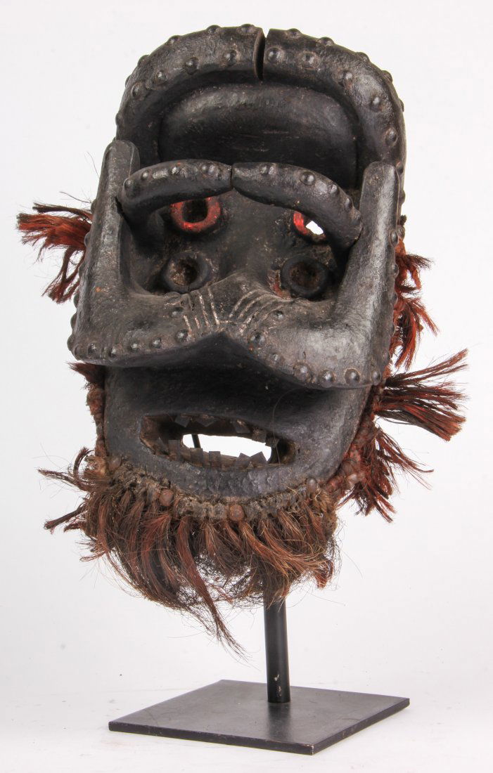 Superb African Bete Mask: Superb African Bete Mask. Carved wood, metal studs and shards, paint and fiber. Size: 12" x 8" x 6". Provenance: Private East Coast Collection.