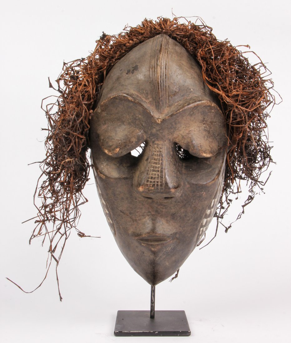 African Pende Mask: African Pende Mask. Carved wood, paint and fiber. Size: 14" x 7" x 4". Provenance: Private East Coast Collection.