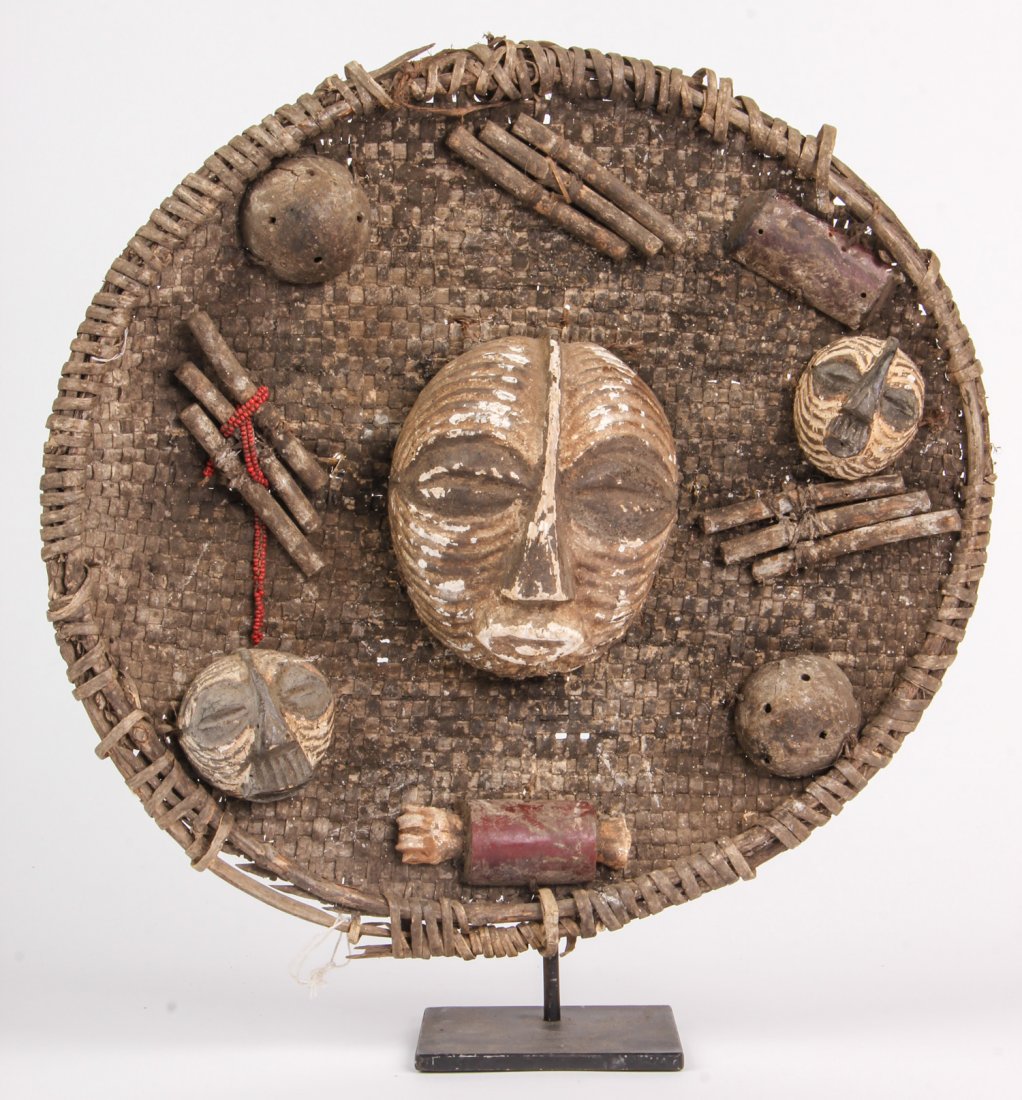 Unique African Luba Plaque: Unique African Luba Plaque. Assemblage of small masks and other symbolic elements mounted on a woven straw sub frame. Size: 13" x 14" x 1". Provenance: Private East Coast Collection.
