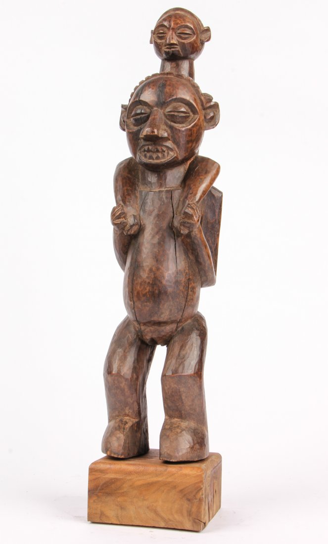 Yaka Tribe Statue of a Dignitary: Yaka Tribe Statue of a Dignitary, Africa.Carved wood. Size: 21" x 5" x 6". Provenance: Private East Coast Collection.