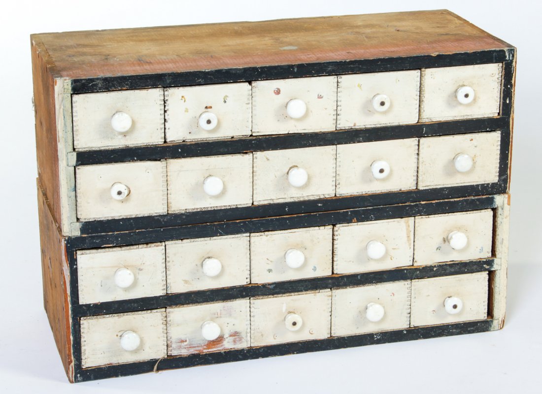 Stack of 2 General Store/Apothecary Style Cases: Stack of 2 General Store/Apothecary Style Cases. Possible remnants of a much larger store fitting. Drawers made from reclaimed crates with porcelain knobs. Early 20th century. Size: 10" x 20" x 12" ea