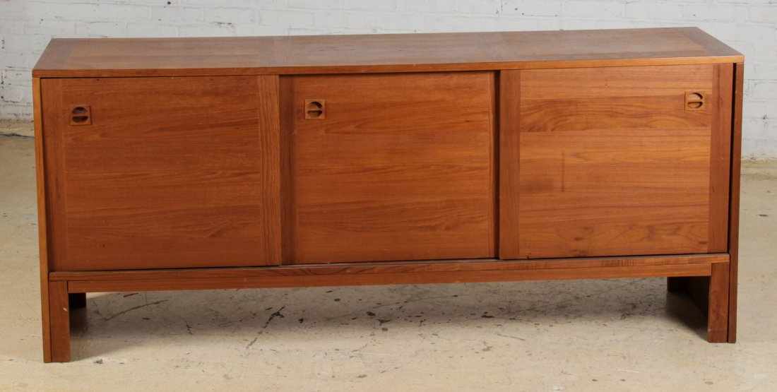 Danish Modern Credenza: Danish Modern Credenza. Three Sliding doors over bracket feet. Size: 30" x 71" x 18.5".