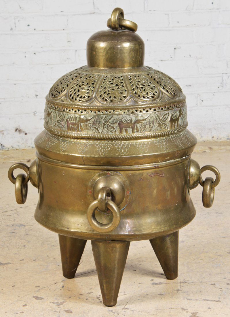 Middle Eastern Lidded Brazier: Middle Eastern Lidded Brazier. Pierced and chased lid with heavy rings at the top and about the tripod base. Size: 30" x 16" x 16".