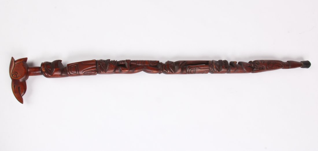 Northwest Coast Inuit Style Totem Walking Stick: Northwest Coast Inuit Style Totem Walking Stick. Carved wood. Size: 34.5" x 5" x 1".