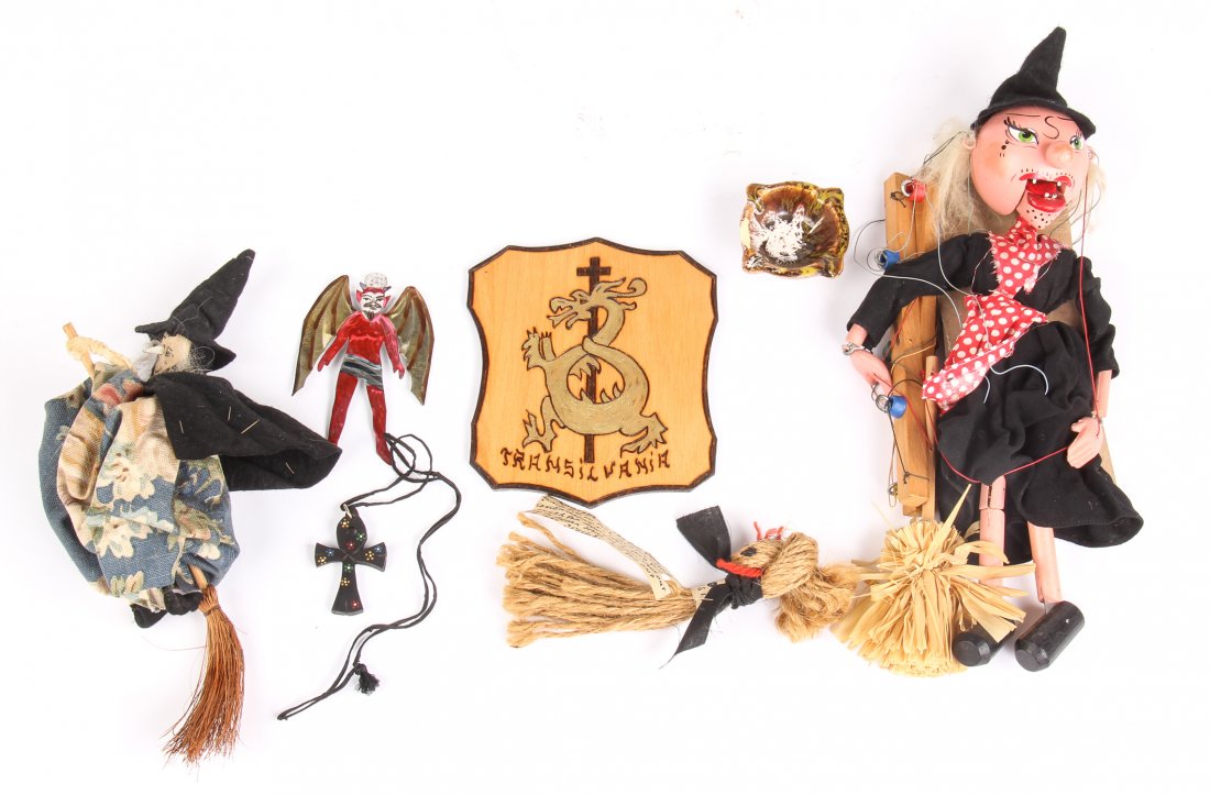 Ethnographic Lot of Folklore Figures and Symbols: Ethnographic Lot of Folklore Figures and Symbols. Including a Witch on a Broomstick, a Black Forest Witch Puppet, a New Orleans Voodoo Doll, a Souvenir Transylvania Plaque, an Egyptian Ankh, and a Mex