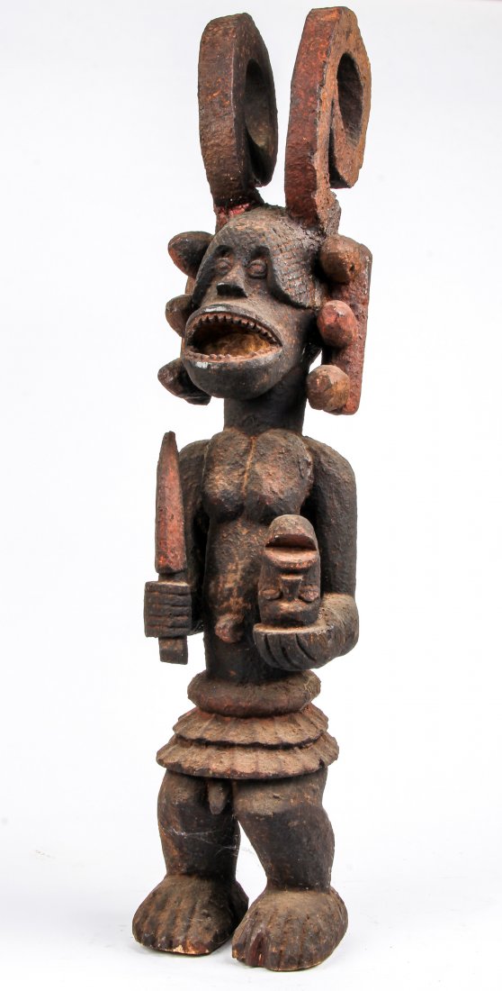 Yoruba/Ibo Ikenga Figure: Yoruba/Ibo Ikenga Figure, Africa. Carved wood and paint. Size: 51" x 11" x 10" (130 x 28 x 25 cm). Provenance: Private collection, Voorhees, NJ.
