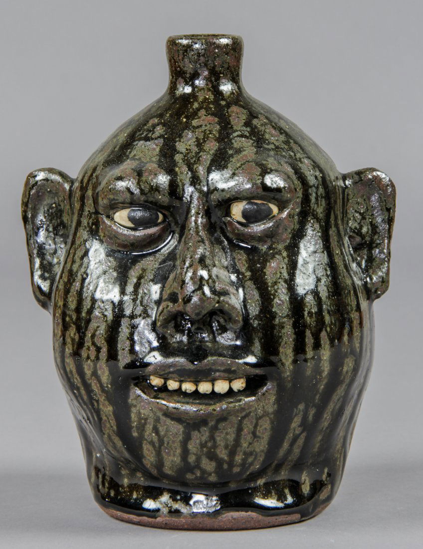 Lanier Meaders (USA, 1917-1998) Face Jug: Lanier Meaders (USA, 1917-1998), Face Jug, glazed ceramic, signed. Size: 9" x 7" x 7".