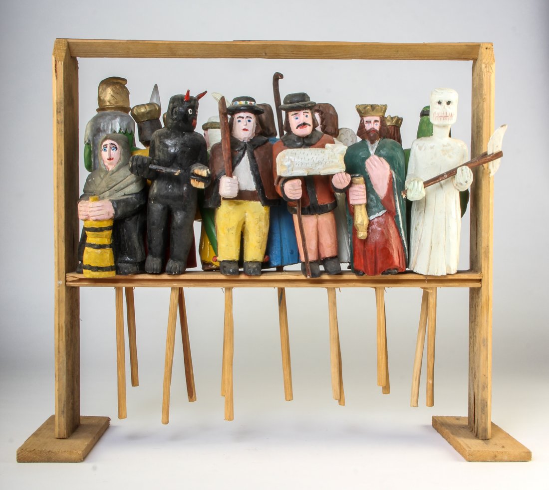 Polish Folk Art wood carving â€“ Puppet Set with Stand: Anonymous, Puppet Set with Stand, Mid 20th c., Polish Folk Art wood carving. Size: 21" x 21" x 8". Typically during Christmas time, these puppet sets would have been carried from house to house, and v