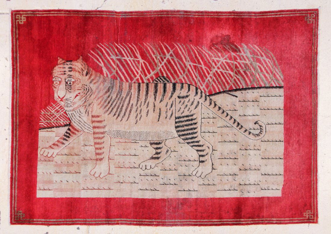 Khotan Pictorial Rug: 4'8" x 6'8": Khotan Pictorial Rug. Western China, Circa 1900. Areas of wear, several old repairs. Size: 4'8" x 6'8", (142 x 203 cm). Provenance: Private Arizona collection.