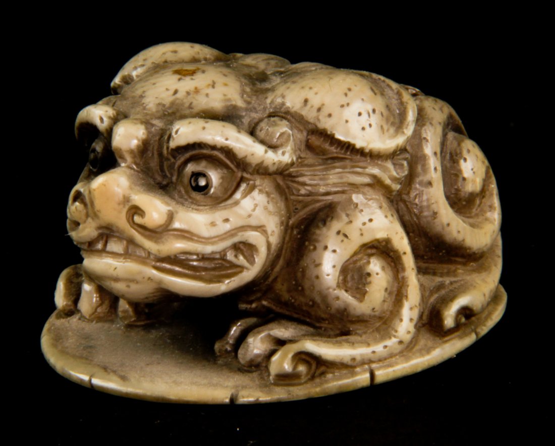 Antique Japanese Ivory Netsuke: Antique Japanese Ivory Netsuke signed Okatomo. Size: 1" x 1" x 2", (2 x 2 x 5 cm).