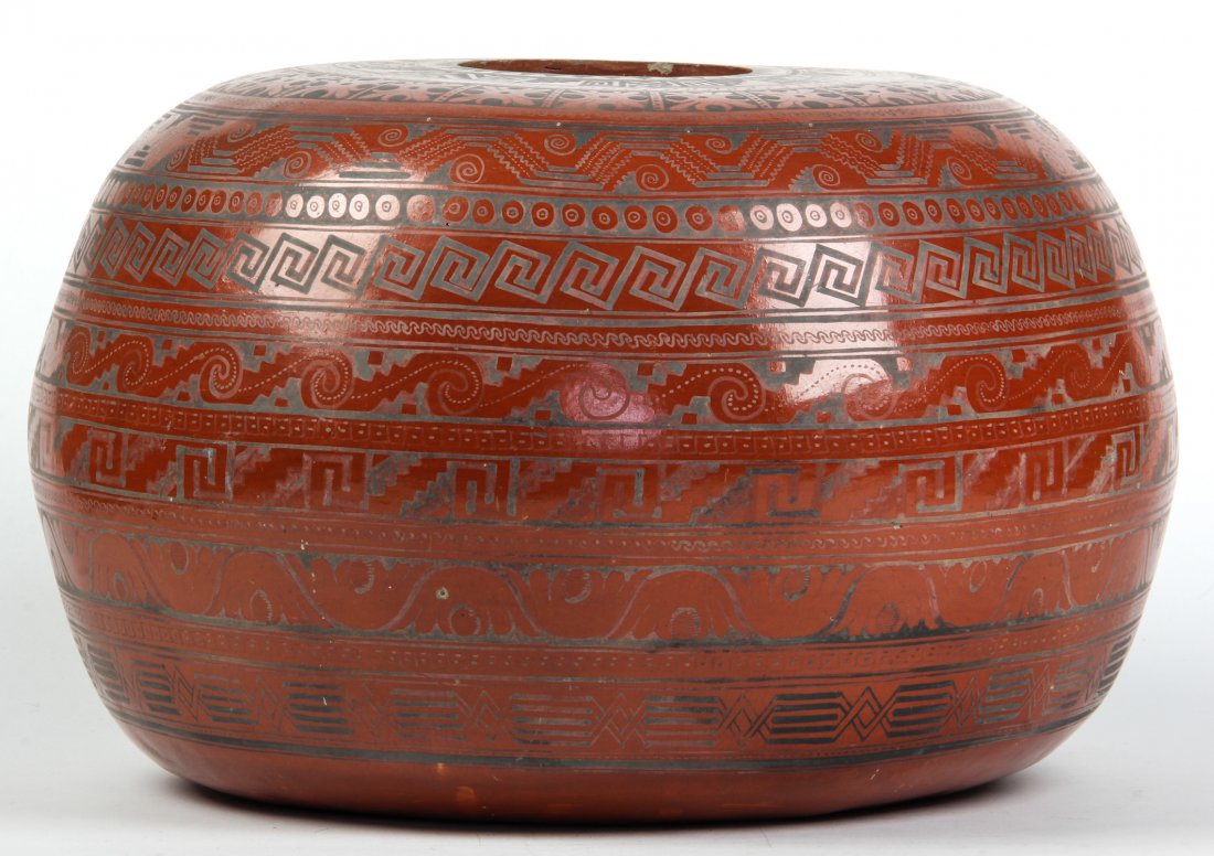 Large Ornate Mexican Bowl, Circa 1921: Ornate Mexican Bowl: deep reddish brown; decorated with rows of geometric and stylized motifs; inscribed: "made by Higinio C. Galvan, in Tonala, Mexico.: "Painted and burnished earthenware made for an