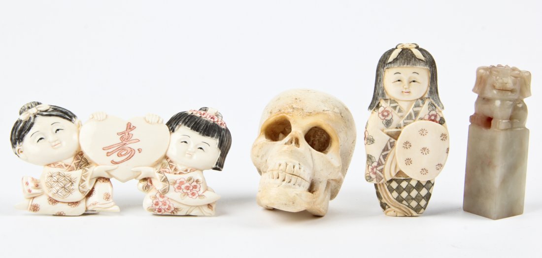 Estate lot of 5 Carved Asian Articles: Estate lot of 5 Carved Asian Articles. Including a Meerschaum Skull, Hardstone Stamp, Carved Bone Japanese Geisha Figure, and a Composite Tabketop Japanese Geisha Placard. Size: 2" x 3.5" x 1" (5 x 9