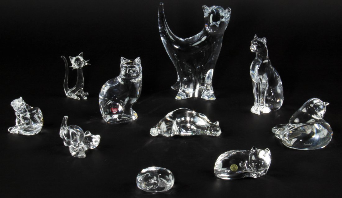 Group of 10 Glass Cat Figurines: Group of 10 Cat Figurines, various makers including: Steuben, Baccarat and Orrefors Ranging in size from: 1.5" x 2.5" x 2.25" (4 x 6 x 6 cm) to 7.75" x 6" x 3" (20 x 15 x 8 cm).