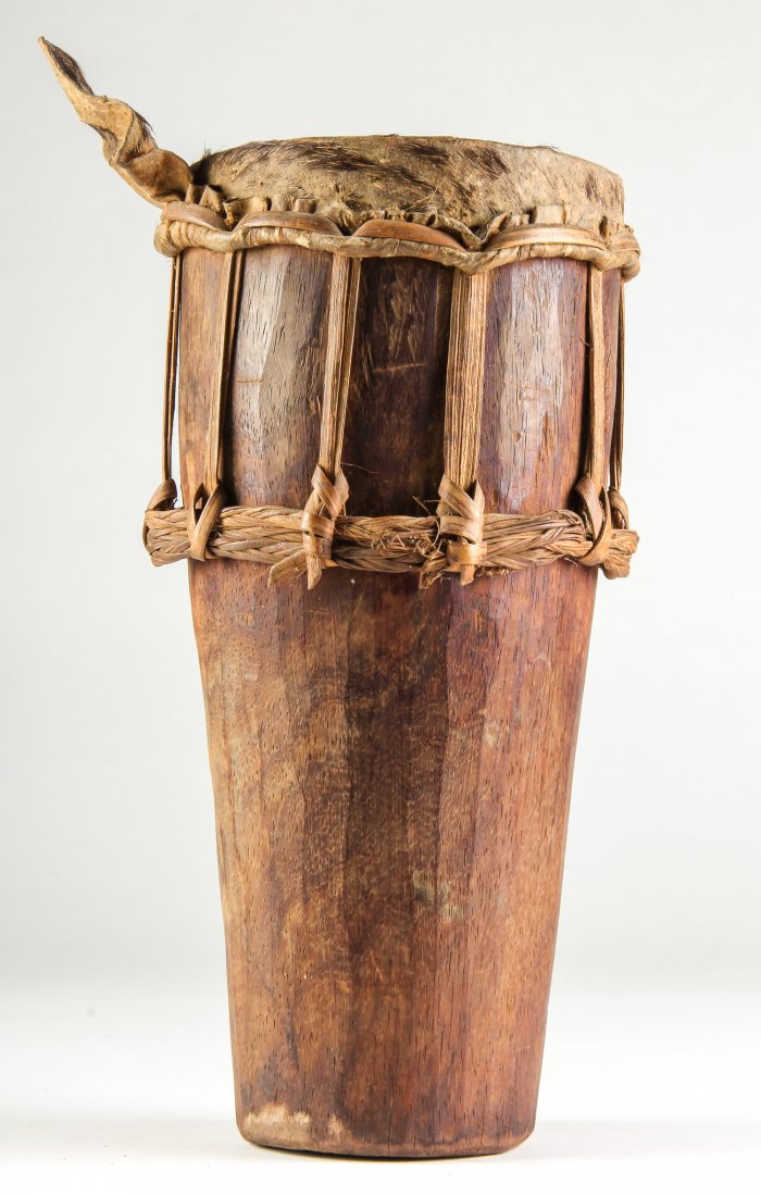 African Drum Hausa Tribe, Nigeria: African Drum, Hausa Tribe, Nigeria, mid 20th Century. Provenance: ex col. Dr. Graham E. Kemp. Size: 13.5" x 6" x 6", (35 x 15 x 15 cm).