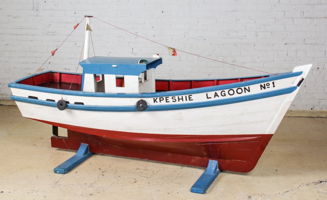 African Coffin Boat by Kane Kwie, Ghana: African Coffin Boat by Kane Kwie (1922-1992, Ghana), Titled "KPESHIE LAGOON", Circa 1970's. Size: 51" x 99" x 28".