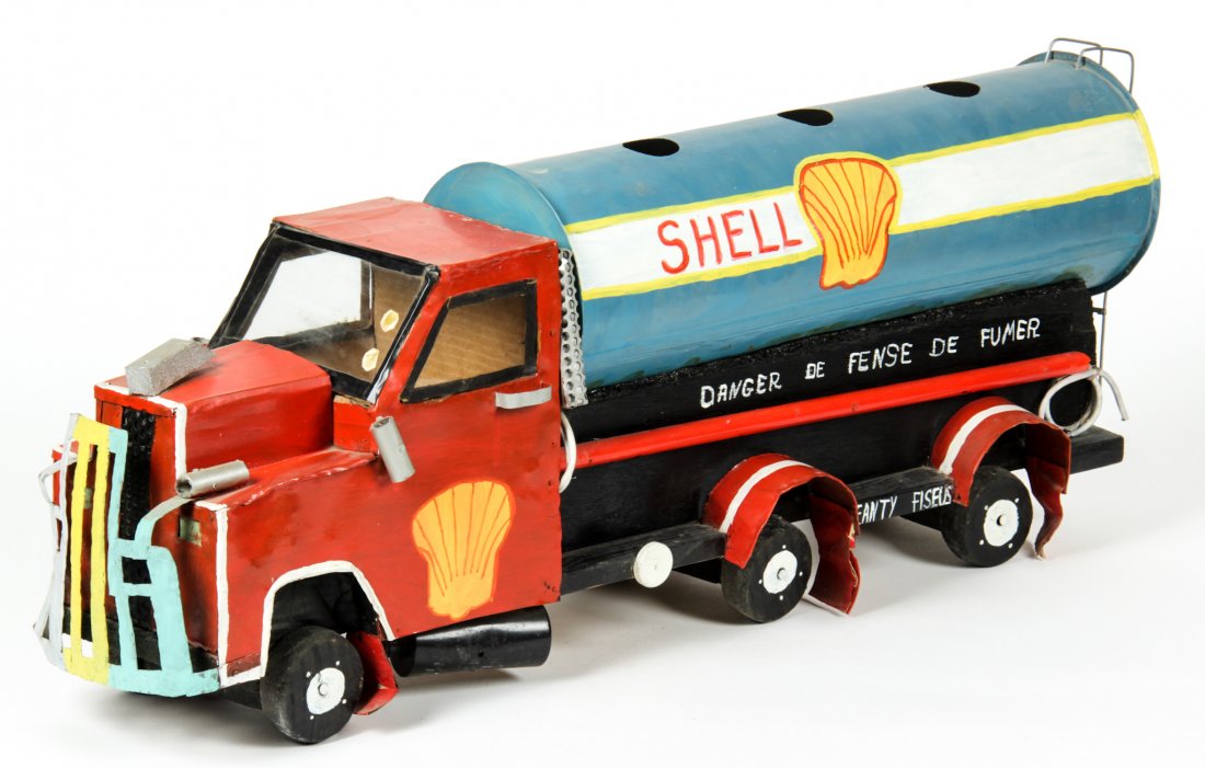 Jeanty Fiseus (Haitian, 20th c.): Jeanty Fiseus (Haitian, 20th c.) Shell Oil Truck, c. 1980's Mixed media, painted wood and metal, 38" x 8.5" x 12.75" Jonathan Demme Collection