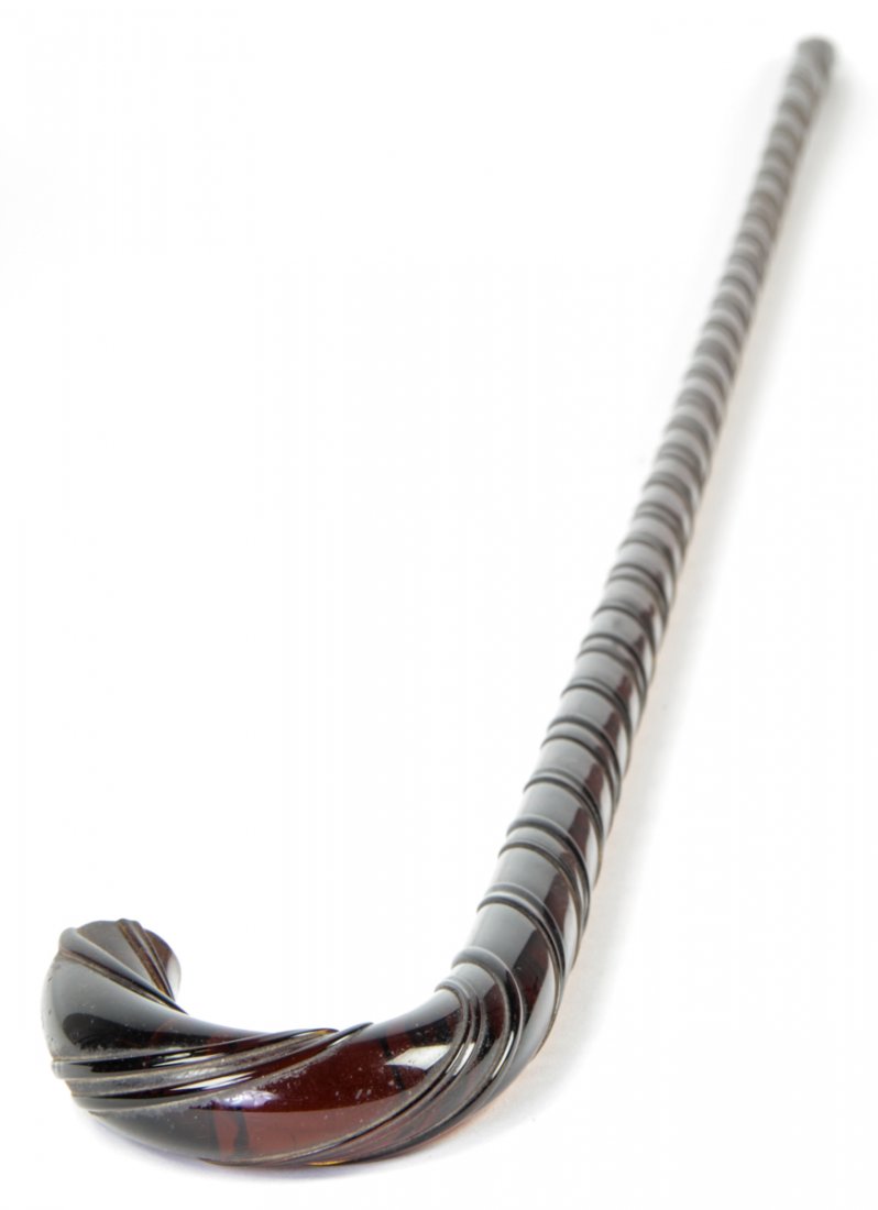 Amber Carnival Glass Cane: Amber carnival glass cane. Size: 43" x 3.5" x 1" (108 x 9 x 3 cm). Kristina Barbara Johnson Estate, Princeton, New Jersey. A portion of auction proceeds to benefit the Arts Council of Princeton's Kris