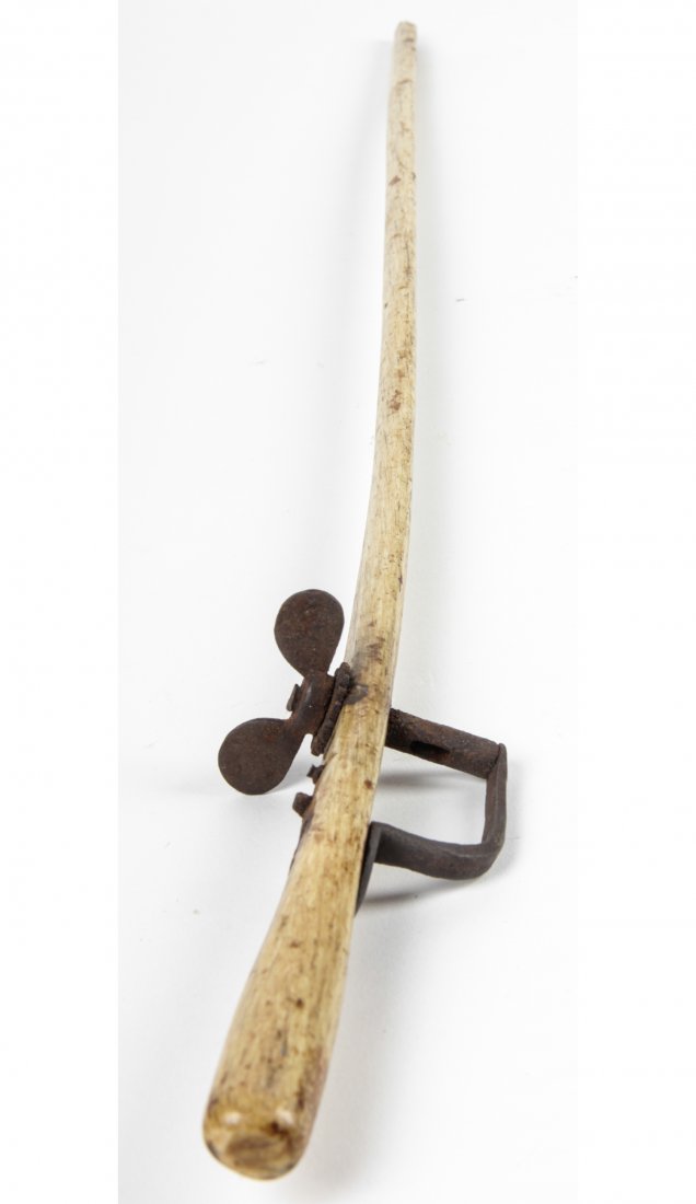 Whaling Era Bone Violin Bow: Whaling era bone violin bow. Fitted with found object metal tension device. Notched at tip. Size: 26" x 3" x 1" (65 x 8 x 3 cm). Kristina Barbara Johnson Estate, Princeton, New Jersey. A portion of au