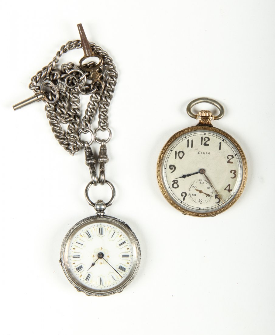 Estate Lot of 2 Pocket Watches: Estate lot of 2 pocket watches. An Elgin, not running, SN #-28164364 in a 10k gold filled case, and a silver pocketwatch with enamel dial and double watch chain with both keys attached Case is marked 