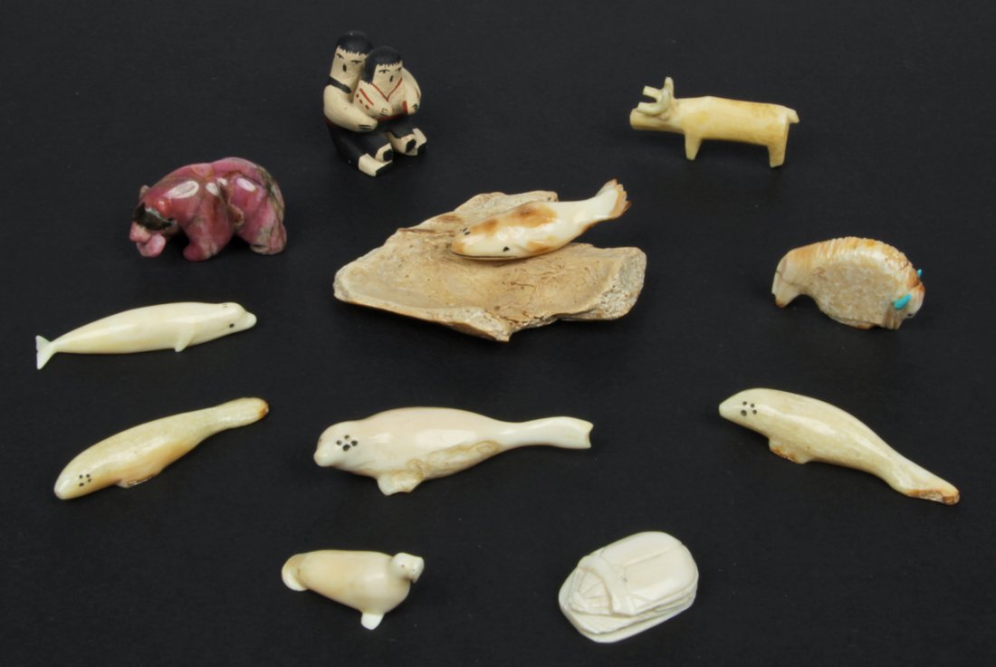 11 Pc Lot of Mixed Culture Fetishes: 11pc lot of mixed culture fetishes. Consisting of 6 whale/walrus ivory seals, 2 hardstone figures of a buffalo and a bear, a carved bone moose, a small pottery "storyteller", and scarab. Size, largest