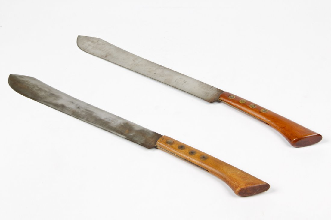 2 WWII Machetes- Bikini Islands: 2 WWII Machetes- Bikini Islands. Branded with rearing lions at swordplay. Size: 28" x 2" x 1" (71 x 5 x 3 cm).