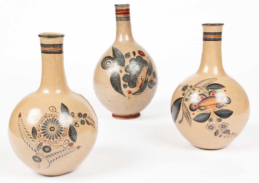 3 Antique Tonala Pottery Bottles: 3 Antique Tonala Pottery bottles. Mexican. The tallest signed to Santiloo (sp?) and the others signed to Emilia and Delfina. The former is signed in pencil on the bottom with an attribution to Malicio