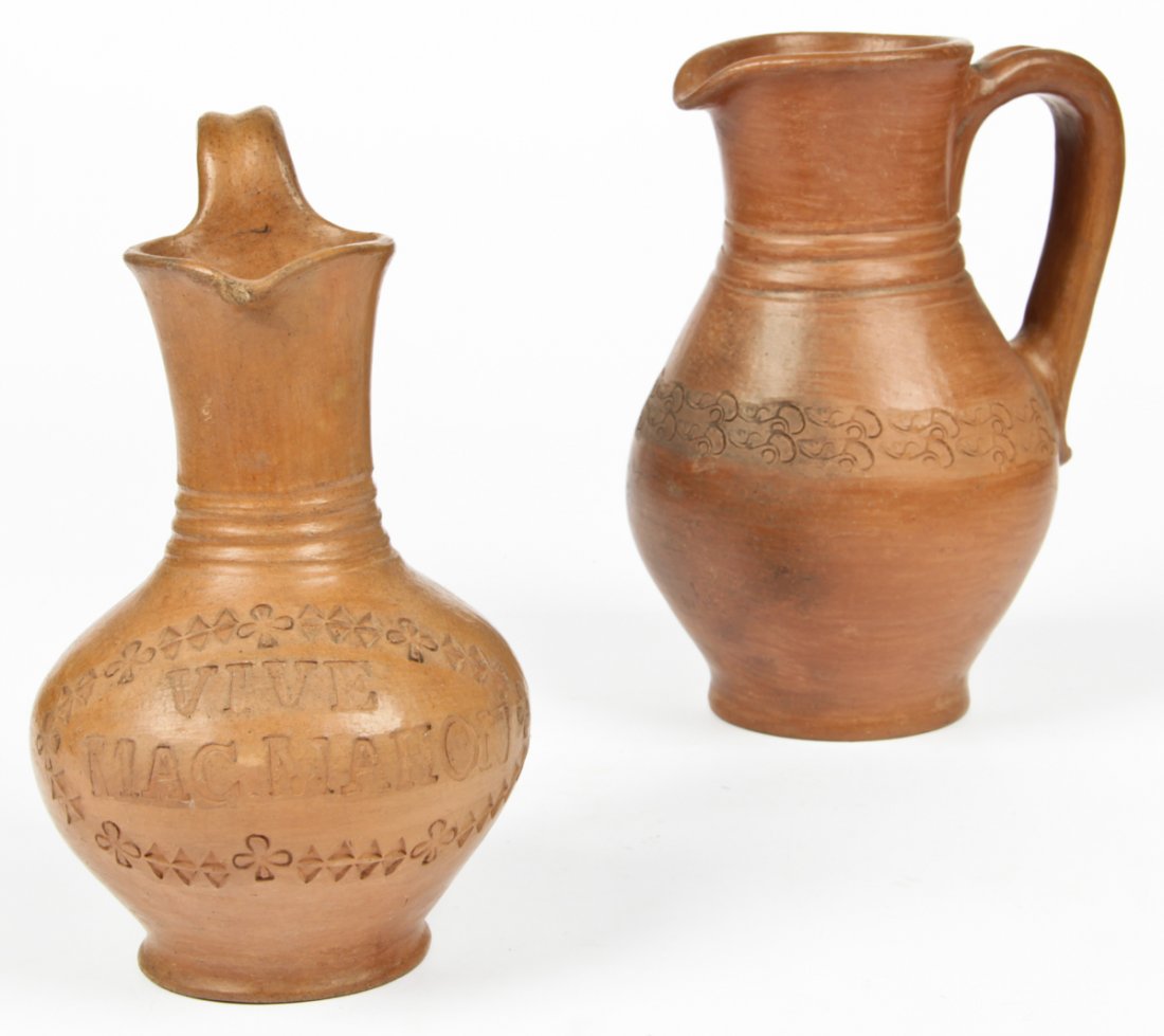 2 Antique St Martin/Maarten Pottery Ewers: 2 Antique St Martin/Maarten pottery ewers. One inscribed " Viva MacMahon" and the other inscribed with an abstract floral motif. Size: taller 9.5" x 6" x 5.5" (24 x 15 x 14 cm). Provenance: Private Ph