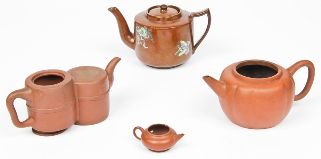 4 Zisha Yixing Teapot: 4 Zisha Yixing Teapots. Consisting of a miniature teapot, a double chamber pot, a gourd shaped pot, and a decorated glazed pot. Size: largest 4.5" x 8" x 5" diameter (11 x 20 x 13 cm). Provenance: Pri