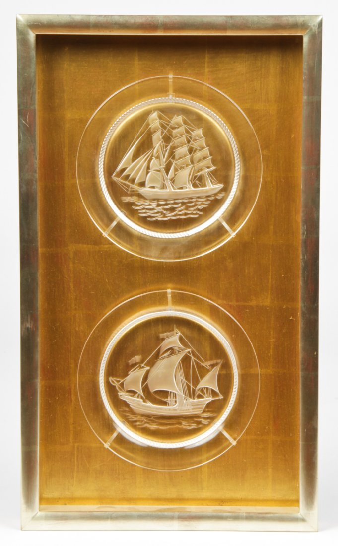 A Pair of Framed Lalique Plates: A Pair of Framed Lalique (French) Plates, each signed in etched script, mounted in a silver and gold leaf shadow box. Sizes: 8.5" x 8.5", 22 x 22 cm (each plate), 24" x 14", 61 x 36 cm (frame).