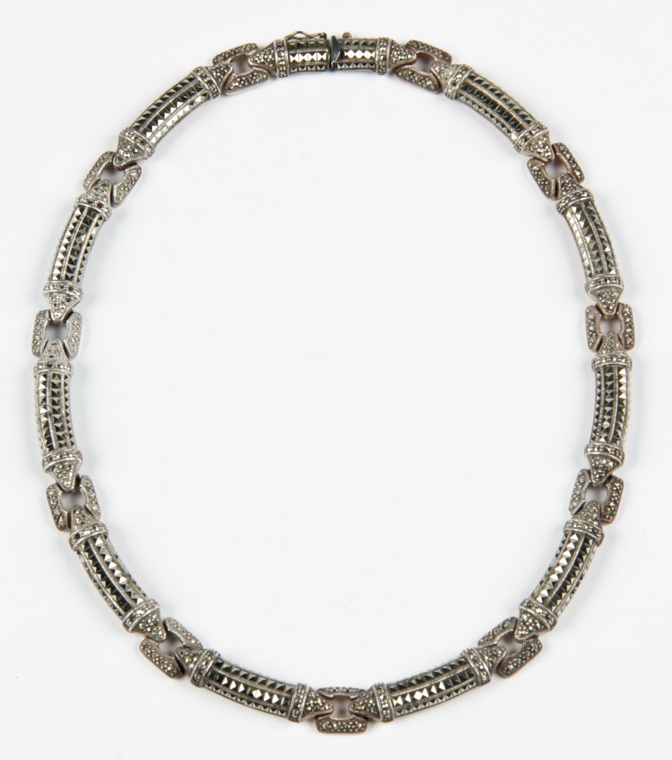 Marcasite Necklace: Marcasite necklace. Marked Sterling. Size: 5.5" (14 cm) diameter.