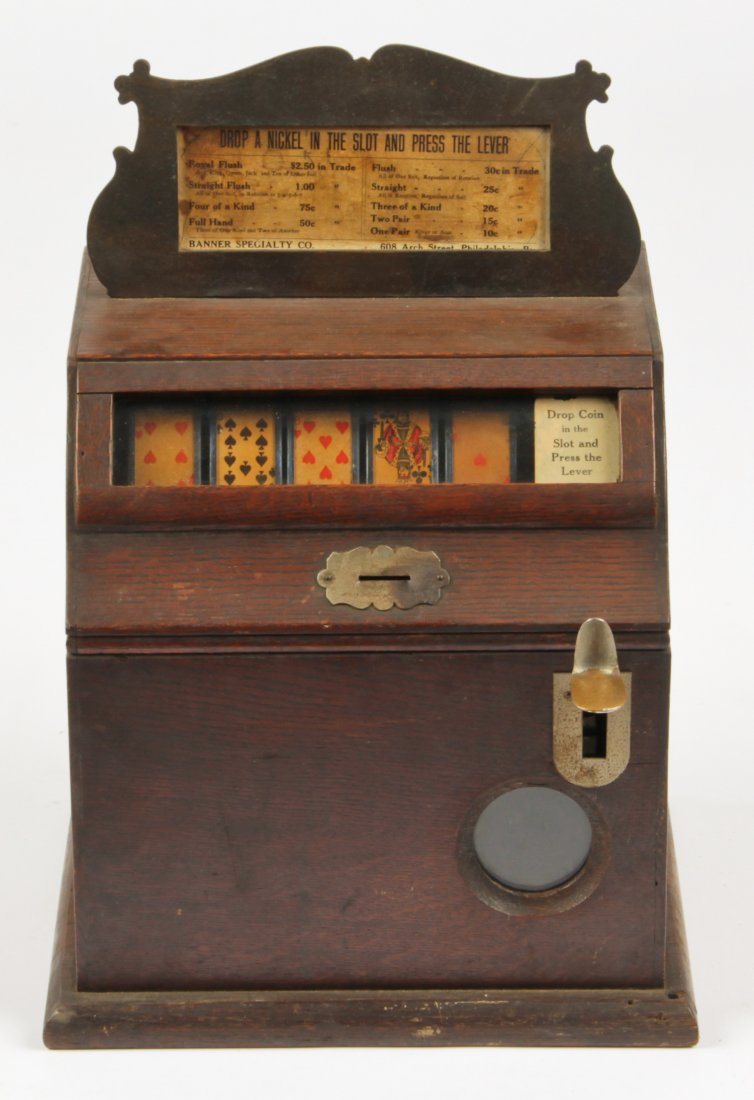 Antique Banner Specialty Co. Nickel Slot Machine: Antique Banner Specialty Co. nickel slot machine. Size: 16" x 11" x 10" (20 x 28 x 25 cm).