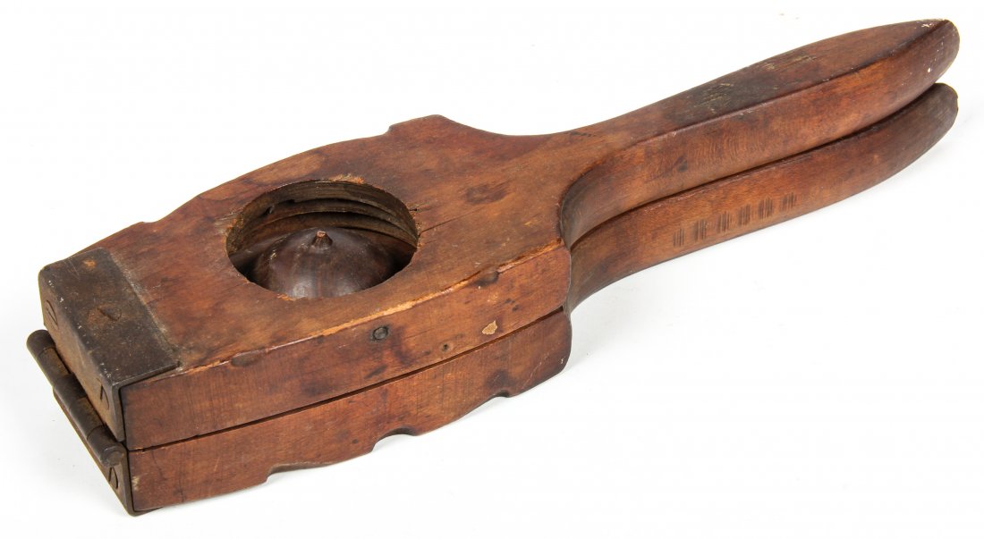 Antique Lemon Press: Antique lemon press. Size: 11" x 3" x 2" (28 x 8 x 5 cm).