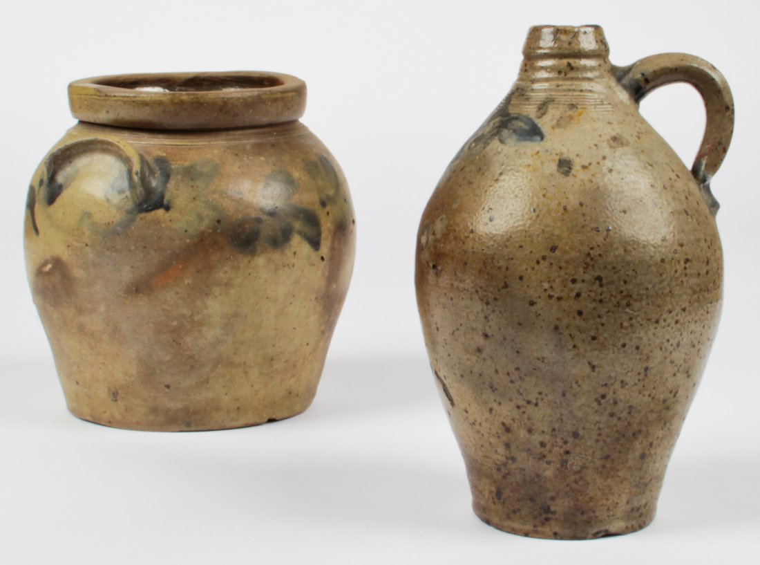 Lot of 2 Early American Stoneware Vessels: Lot of 2 Early American stoneware vessels. 1 jar and 1 jug with flow blue touches. Sizes: 10" x 6.5" x 6" (25 x 17 x 15 cm), and 8.5" x 8.5" x 8.5" (22 x 22 x 22 cm).
