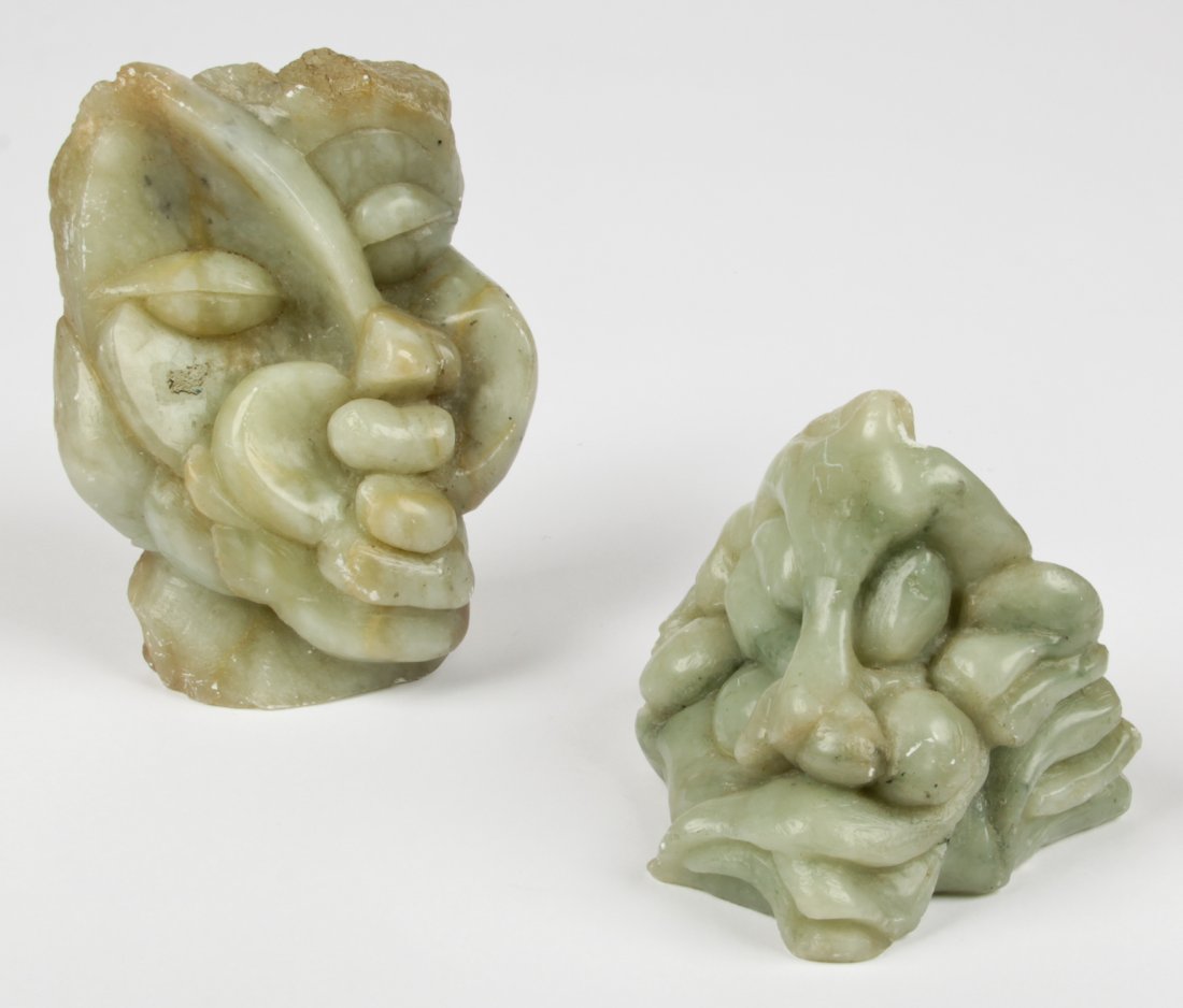Pair of Free-Form Soapstone Sculptures: Pair of free-form soapstone sculptures resembling human faces. Size: larger 7" x 5" x 3" (18 x 13 x 8 cm).