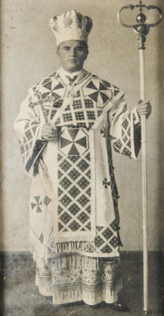 Eastern European Folk Art Framed Photograph: Eastern European Folk Art framed photograph of a diocesan figure. Frame inlaid and embellished with nacre, beads and silver. 20th C. Size: 9" x 4.75", 23 x 12 cm (sight), 12.25" x 8.25", 31 x 21 cm (f