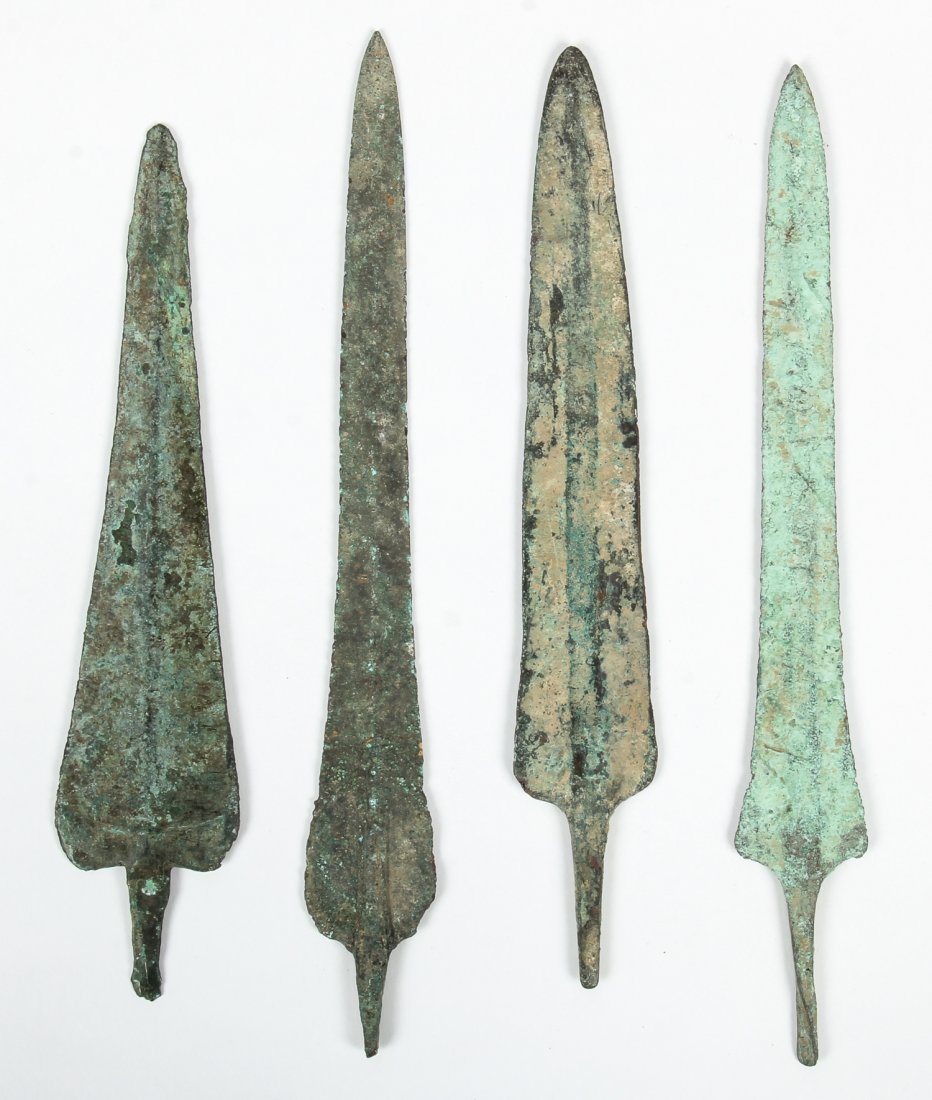 4 Ancient Near Eastern Bronze Spear Heads: 4 Ancient Near Eastern Bronze Spear Heads. Size: longest 10.5" x 1.75" (27 x 4 cm). ex: Arthur M Sackler Collection, Millea Bros.