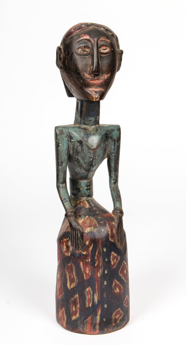 Indonesian Carved Wood Polychrome Figure: Indonesian Carved Wood Polychrome Figure. Size: 20" x 5" x 5" (51 x 13 x 13 cm).