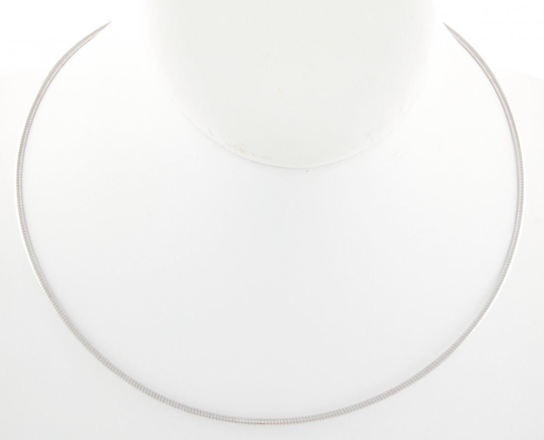14K White Gold Hoop Necklace: 14K White Gold Hoop Necklace marked 585. 15"L (38 cm). 7.7 g. Since 1937, the The Silver Shop of Princeton, NJ was located at 59 Palmer Square West.