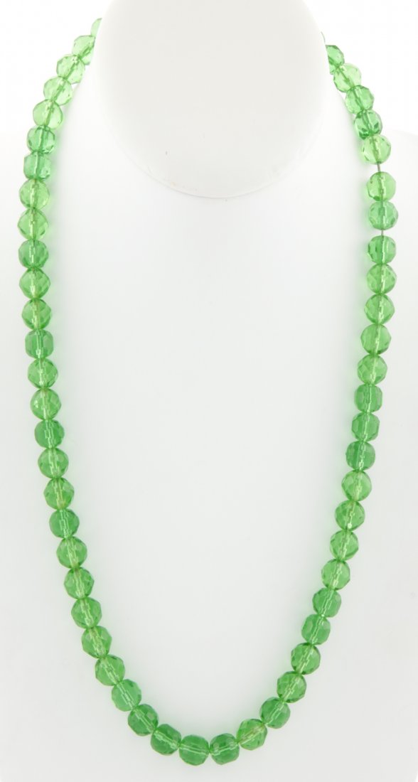 Peridot-Colored Czech Glass Beaded Necklace: Peridot-Colored Czech Glass Beaded Necklace. Clasp marked 14K. 24"L (61 cm). 73.1 g. Since 1937, the The Silver Shop of Princeton, NJ was located at 59 Palmer Square West.