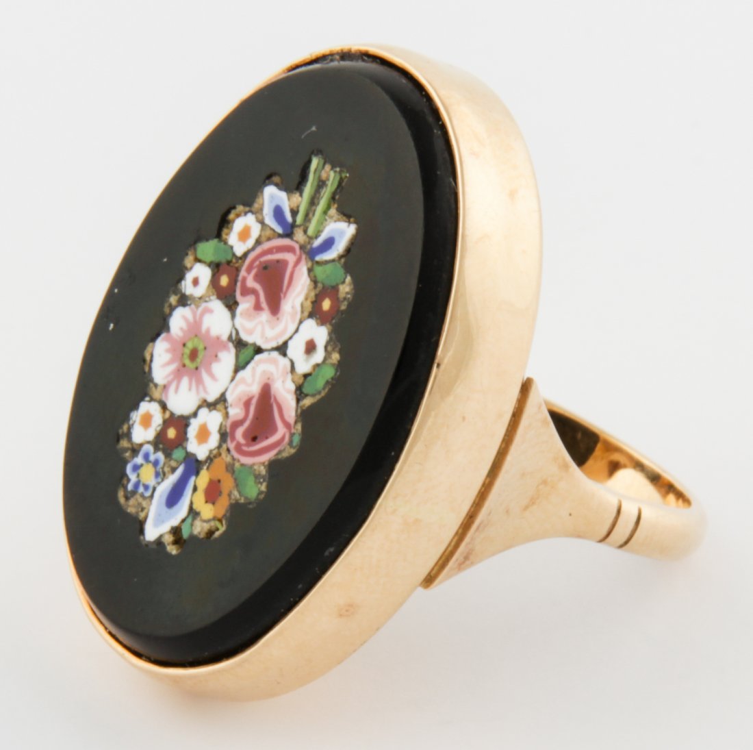 14K Millefiore Ring: 14K Millefiore Ring. Inlaid Flower Motif set in Onyx. Marked JM and 585. Well executed. Size 7.5. 15.6 g. Since 1937, the The Silver Shop of Princeton, NJ was located at 59 Palmer Square West.