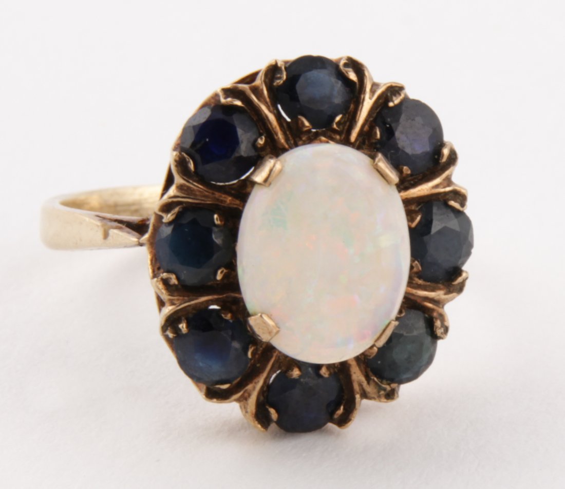 Gold, Opal and Sapphire Ring: Gold, Opal and Sapphire Ring marked 375 for 9K. English Hallmarks for London. Size 8. Since 1937, the The Silver Shop of Princeton, NJ was located at 59 Palmer Square West.