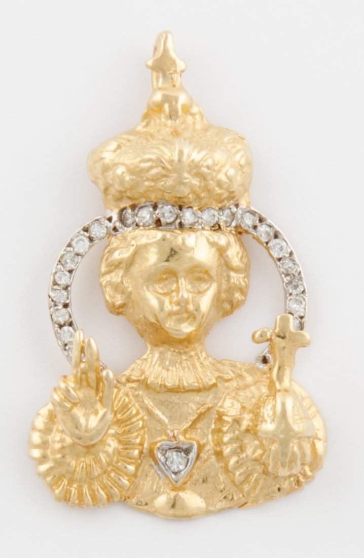 Gold and Diamond Christ Child Pendant Depicted as: Gold and Diamond Christ Child Pendant depicted as Infant of Prague. Size: 1.25" x 3/4" (3 x 2 cm). 7.8 g. Since 1937, the The Silver Shop of Princeton, NJ was located at 59 Palmer Square West.