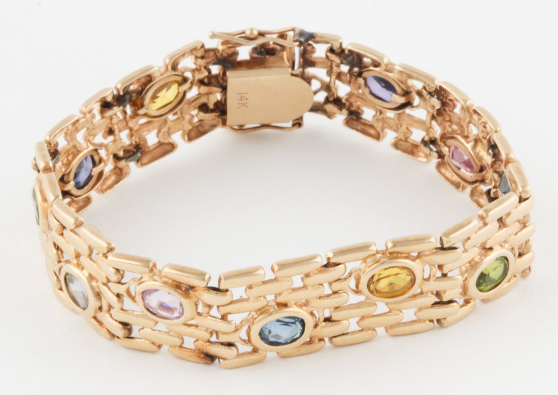 14K Gold Bracelet with Multi-set Gemstones: 14K Gold Bracelet with Multi-set Gemstones. 1960's. Size: 7.5"L x 1/2"W (19 x 1 cm). Since 1937, the The Silver Shop of Princeton, NJ was located at 59 Palmer Square West.