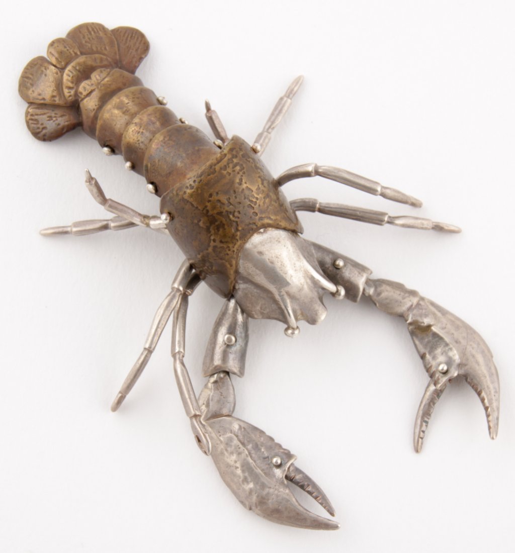 Luna Parc Lobster Pin: Luna Parc Lobster Pin. Silver and Bronze Articulated Naturalistic Brooch. 3.5" x 2.25". 0.99 ozt. Since 1937, the The Silver Shop of Princeton, NJ was located at 59 Palmer Square West.