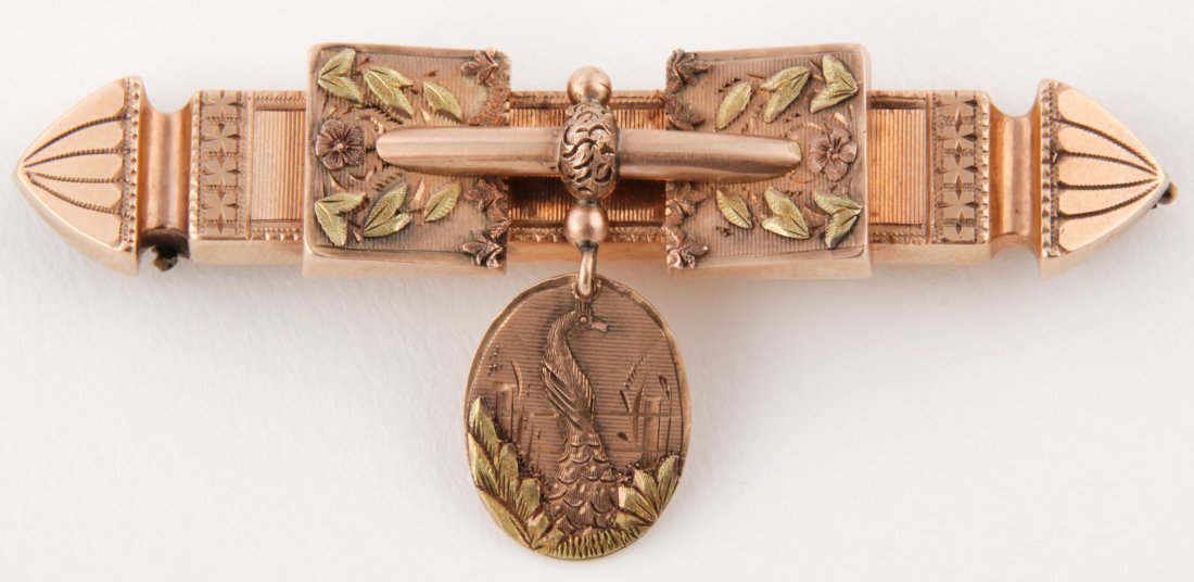 Antique Gold Bar Pin with Pendant: Antique Gold Bar Pin with Pendant suspended depicting Peacock. High Karat Gold. Unmarked. 2 3/8"L. 0.22 ozt. Since 1937, the The Silver Shop of Princeton, NJ was located at 59 Palmer Square West.