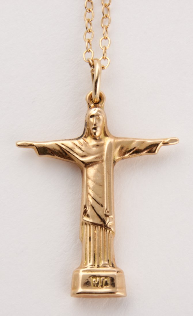14K Gold Christ the Redeemer Pendant: Gold Christ the Redeemer Pendant marked Rio 14K. 16"L. 0.11 ozt. Since 1937, the The Silver Shop of Princeton, NJ was located at 59 Palmer Square West.