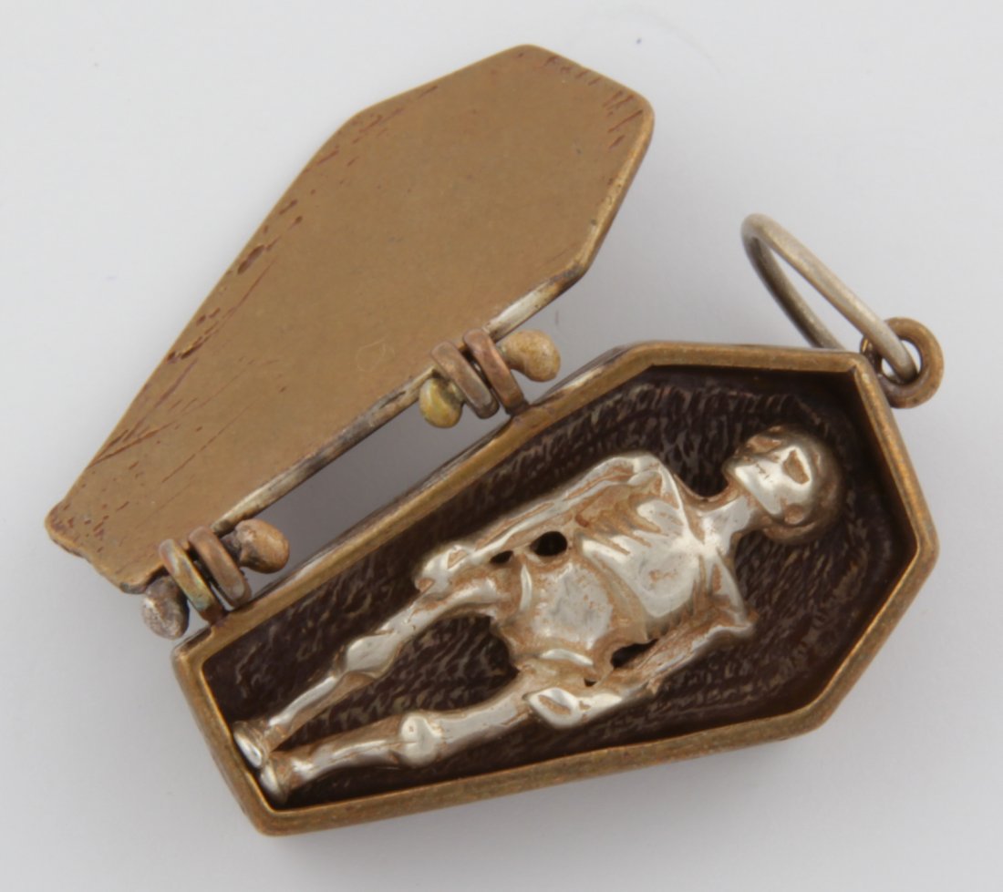 Luna Parc Silver and Bronze Skeleton in a Coffin: Luna Parc Silver and Bronze Skeleton in a Coffin Pendant. Size: 1" x 3/4" (3 x 2 cm). 9.3 g. Since 1937, the The Silver Shop of Princeton, NJ was located at 59 Palmer Square West.