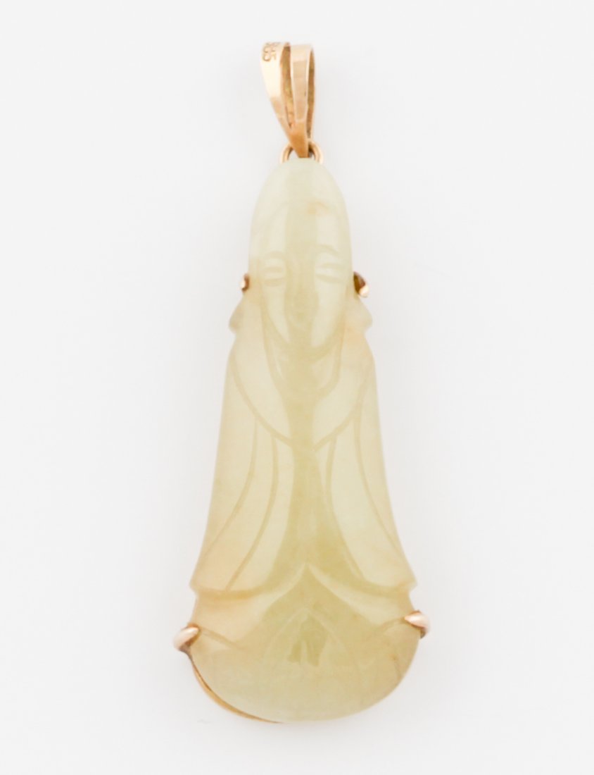 Jade and 14K Gold Buddha Pendant: Jade and Gold Buddha Pendant marked 14K 585. 1.75" x 0.75" (4.5 x 2 cm). 7.5 g. Since 1937, the The Silver Shop of Princeton, NJ was located at 59 Palmer Square West.