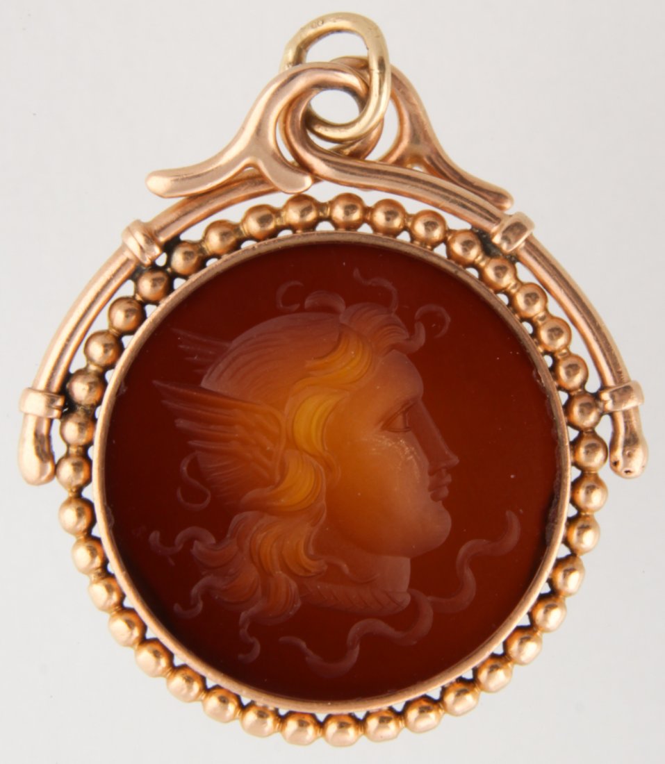 Antique Gold and Carved Carnelian Cameo Pendant: Antique Gold and Carved Carnelian Cameo Pendant. Beautiful Depiction of Mercury set in a Bezel Beaded Frame with Ornate Bail Support. Unmarked. 1"D (2.5 cm). 4.4 g.Since 1937, the The Silver Shop of P